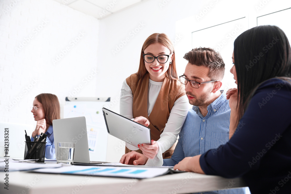 Colleagues discussing issue at business meeting in office