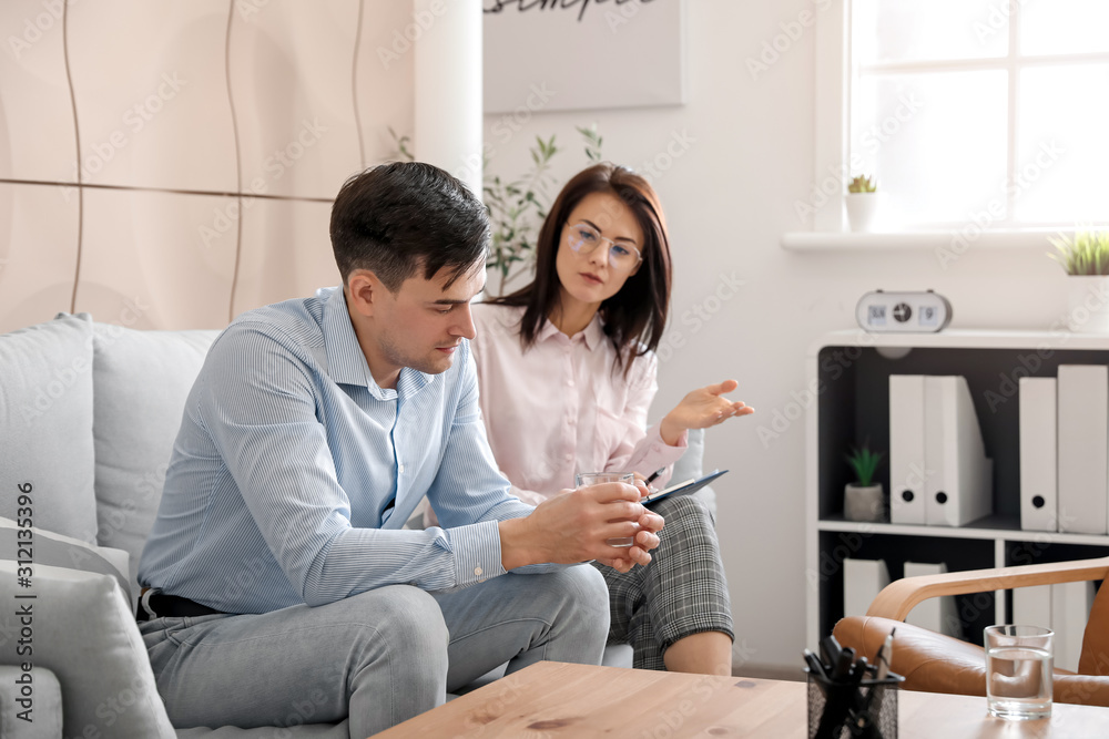 Psychologist working with patient in office