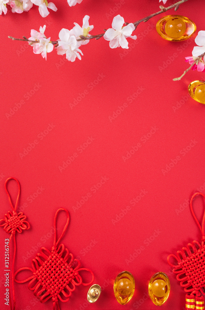 Design concept of Chinese lunar new year - Beautiful Chinese knot with plum blossom isolated on red 