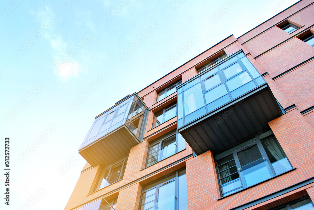 Sun rays light effects on urban buildings. Fragment of modern residential apartment with flat buildi