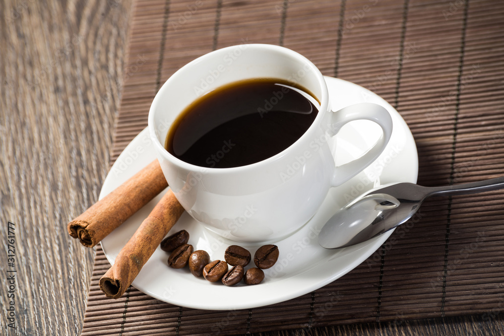 Cup of espresso coffee on wooden table