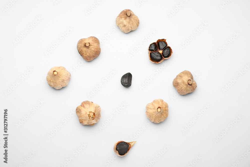 Black garlic on white background