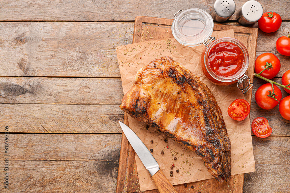 Meat with tasty barbecue sauce on table