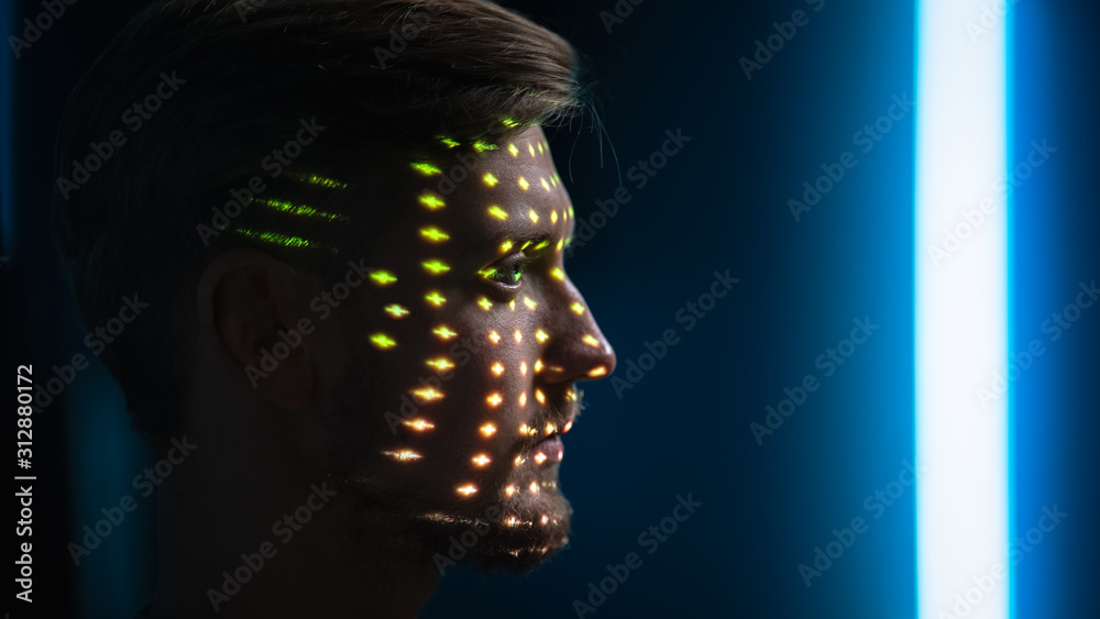 Handsome Young Caucasian Man is Identified by Biometric Facial Recognition Scanning Process. Futuris