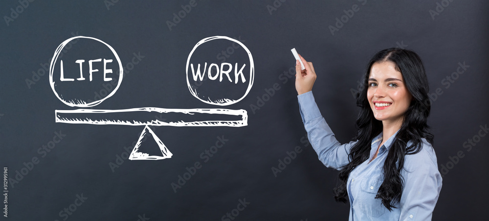 Life and work balance with young woman writing on a blackboard