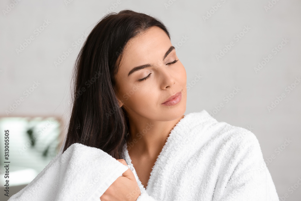 Beautiful young woman after taking bath at home