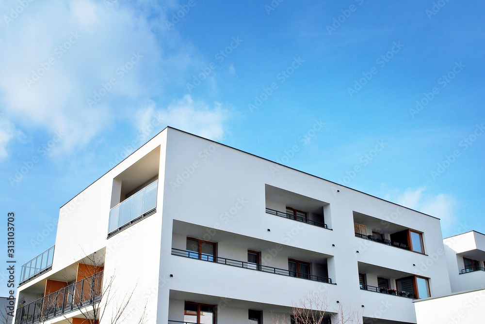 Modern apartment buildings on a sunny day with a blue sky. Facade of a modern apartment building