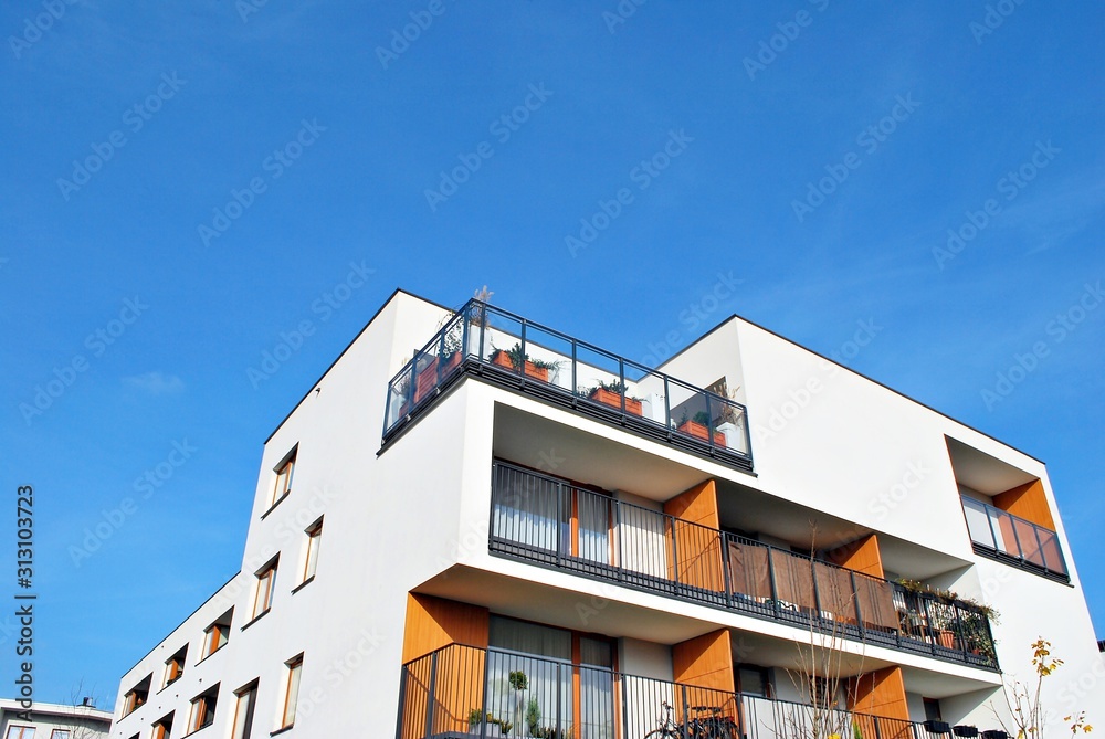 Modern apartment buildings on a sunny day with a blue sky. Facade of a modern apartment building