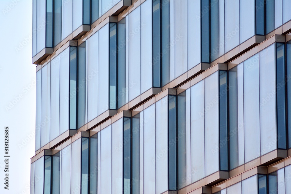 The windows of a modern building for offices. Business buildings architecture.