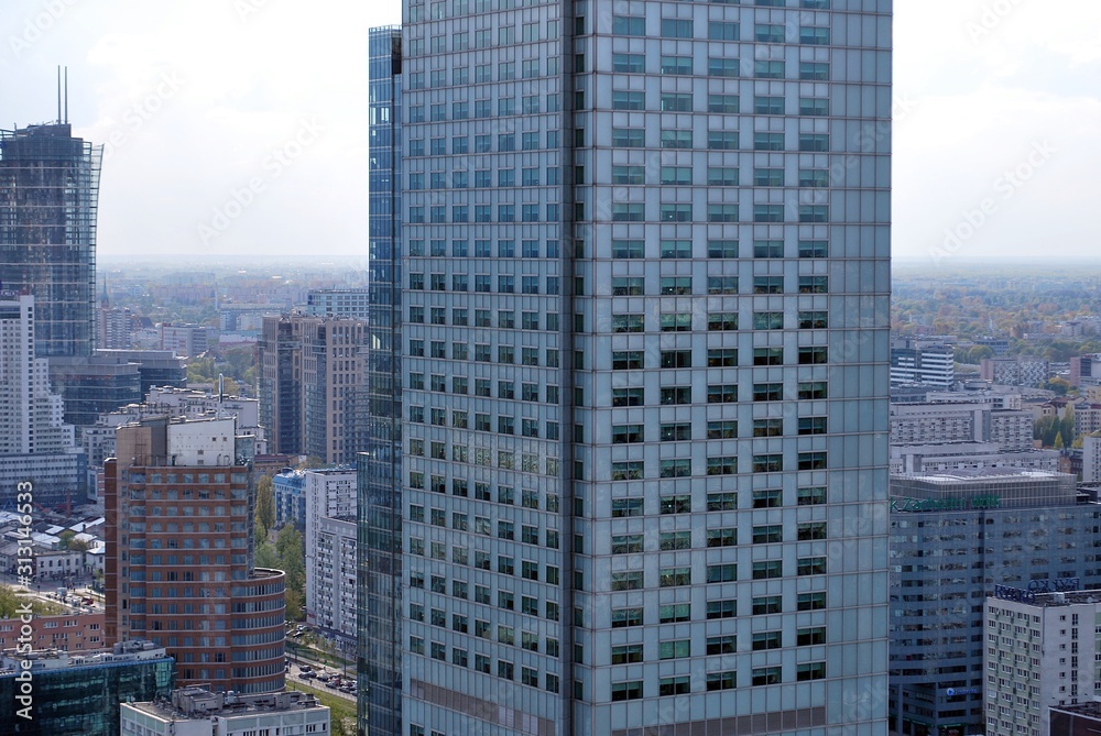 Abstract image of looking up at modern glass and concrete building. Architectural exterior detail of