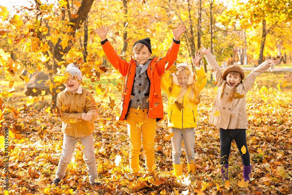 Cute little children having fun in autumn park