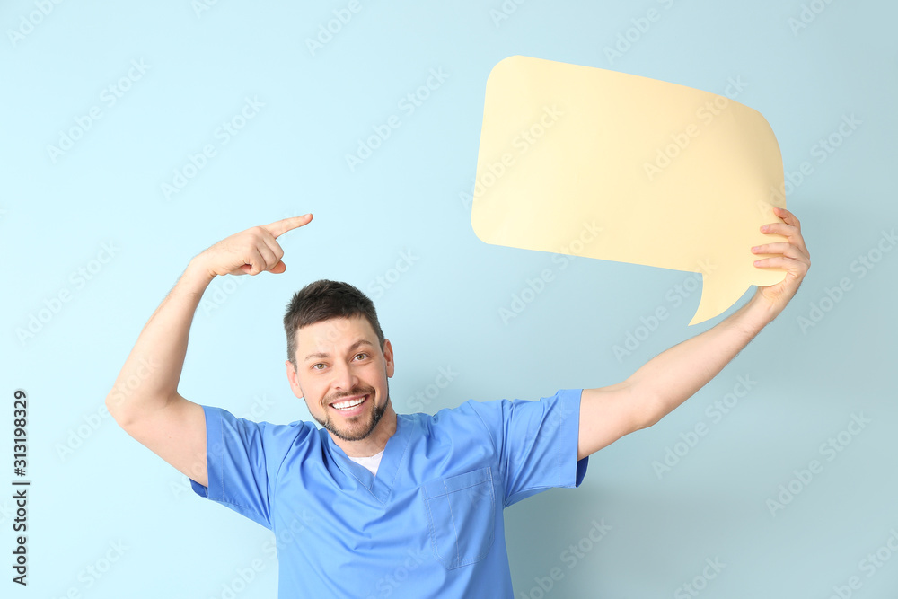 Man with blank speech bubble on color background