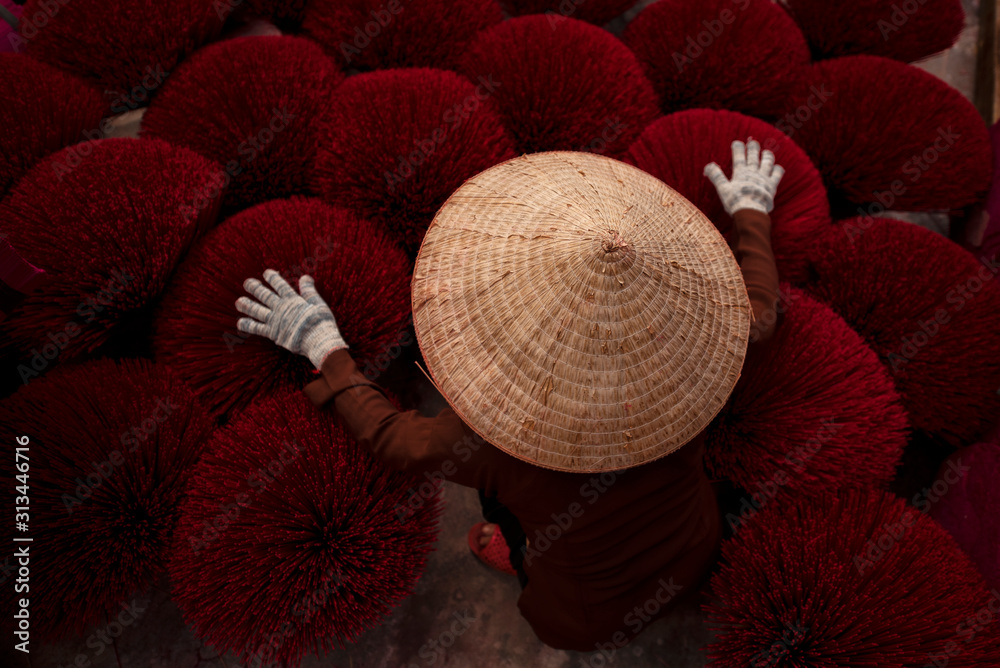 Women in a village in northern Vietnam Bringing the incense to dry For use according to the Chinese 