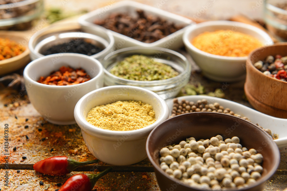 Different spices on wooden table