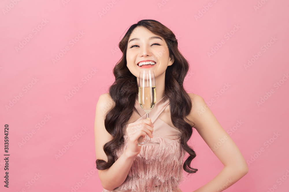 Portrait of a beautiful asian woman with glass of champagne.