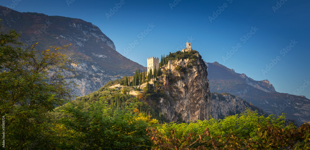 Amazing ruins of Arco Castle on the rock in northern Italy.