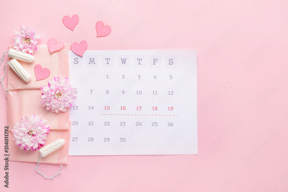 Menstrual calendar with feminine products on color background