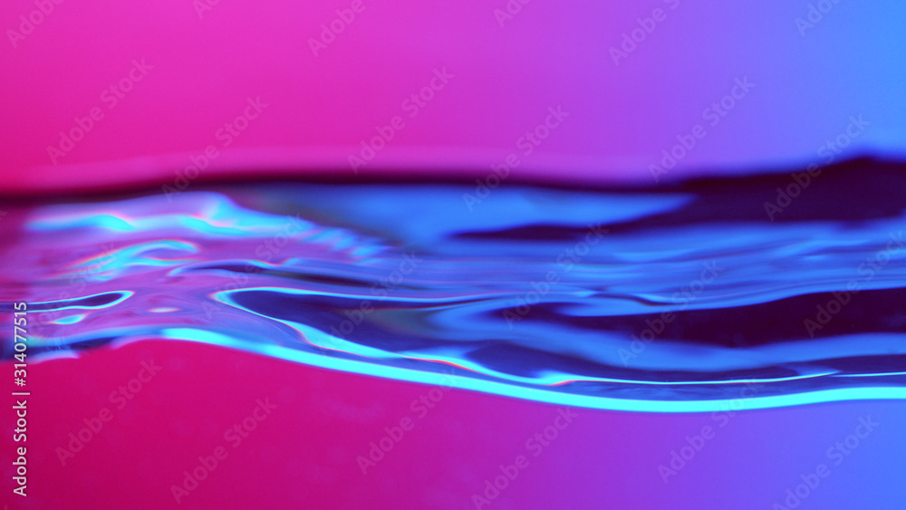 Detail of water waves in neon lights