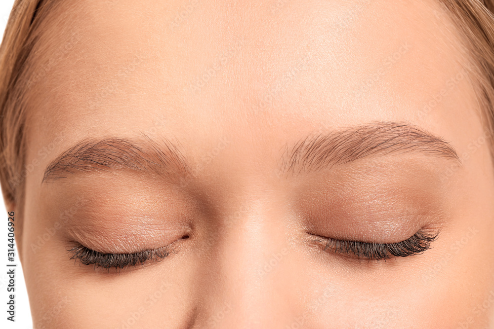 Young woman with beautiful eyebrows, closeup