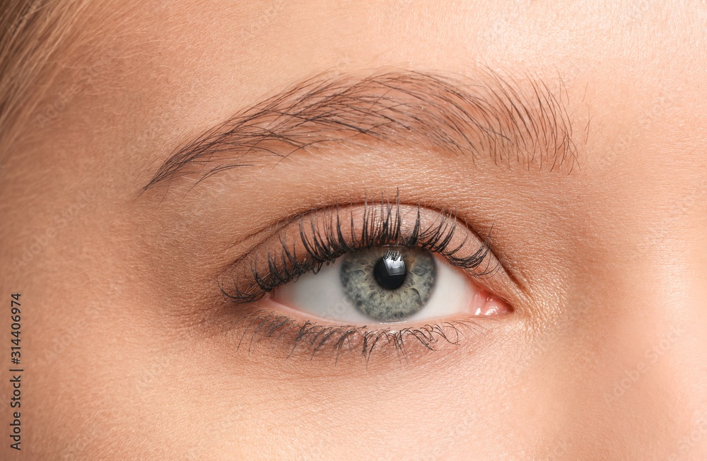 Young woman with beautiful eyebrows, closeup