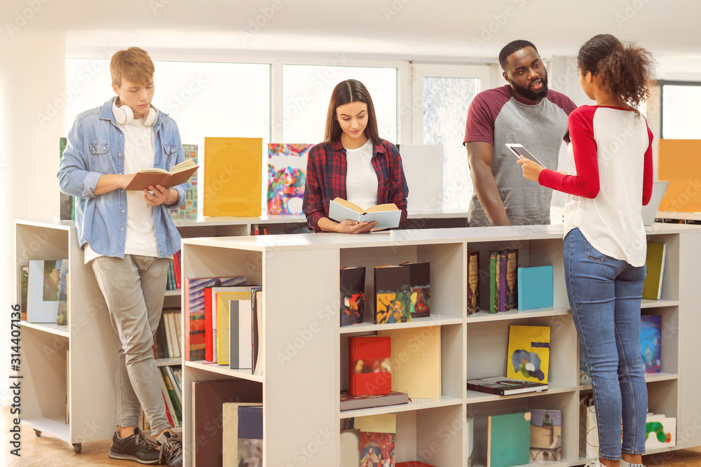 Young students preparing for exam in library