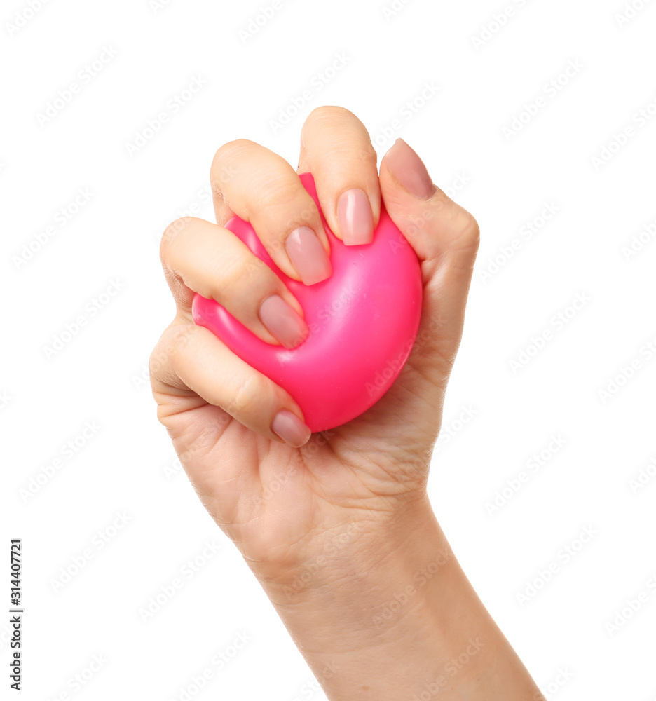 Female hand squeezing stress ball on white background