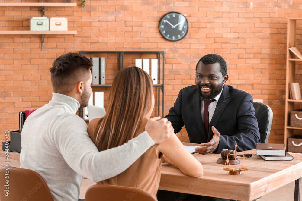 Couple visiting lawyer in office