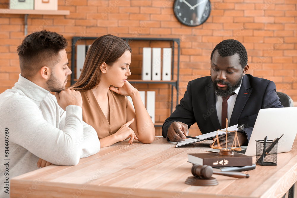 Couple visiting lawyer in office