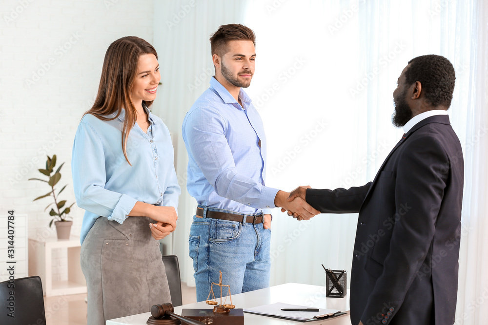 Couple visiting lawyer in office