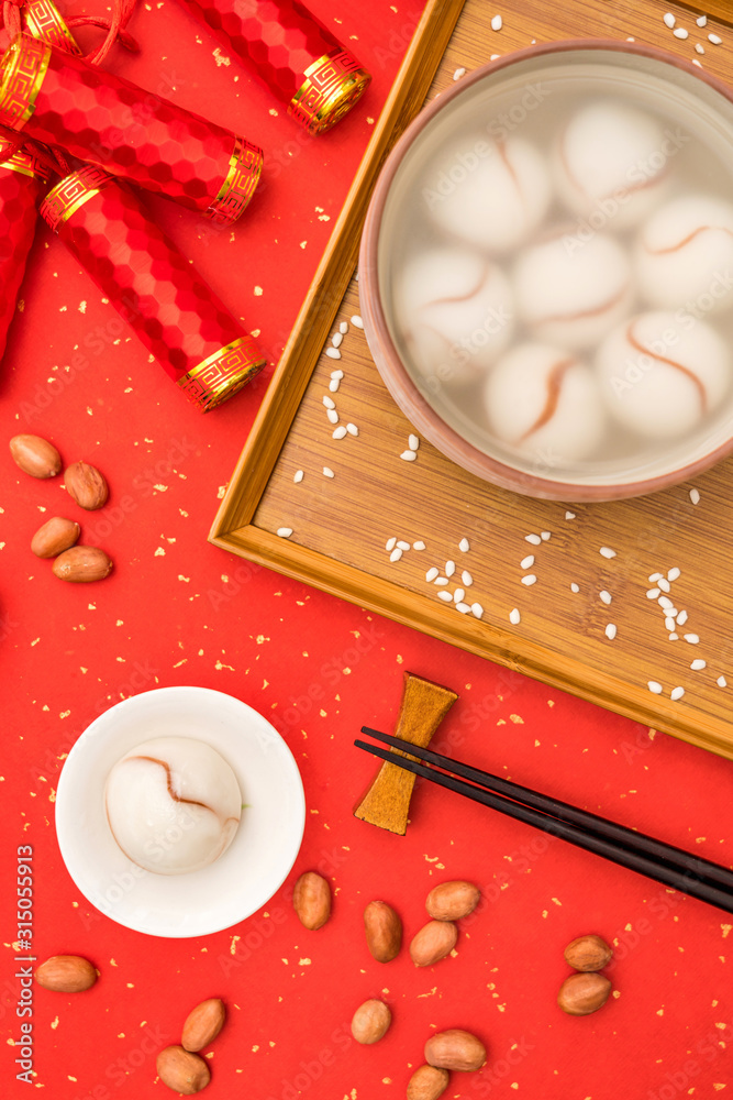 Chinese Lantern Festival traditional cuisine peanut dumplings on red background