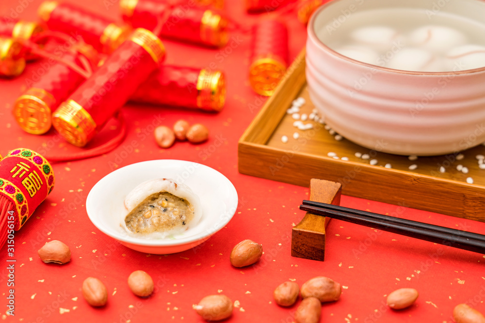 Chinese Lantern Festival traditional cuisine peanut dumplings on red background