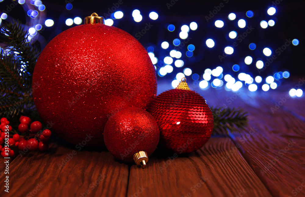 Red Christmas balls on a wood