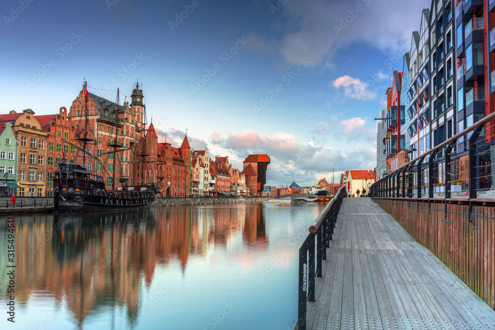 Beautiful scenery of the old town in Gdansk over Motlawa river at sunrise, Poland.