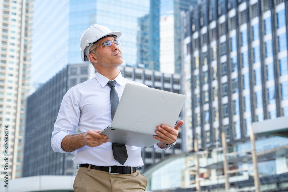 Businessman use of laptop computer at outdoor,With copy space for text.Concept of business mistakes.