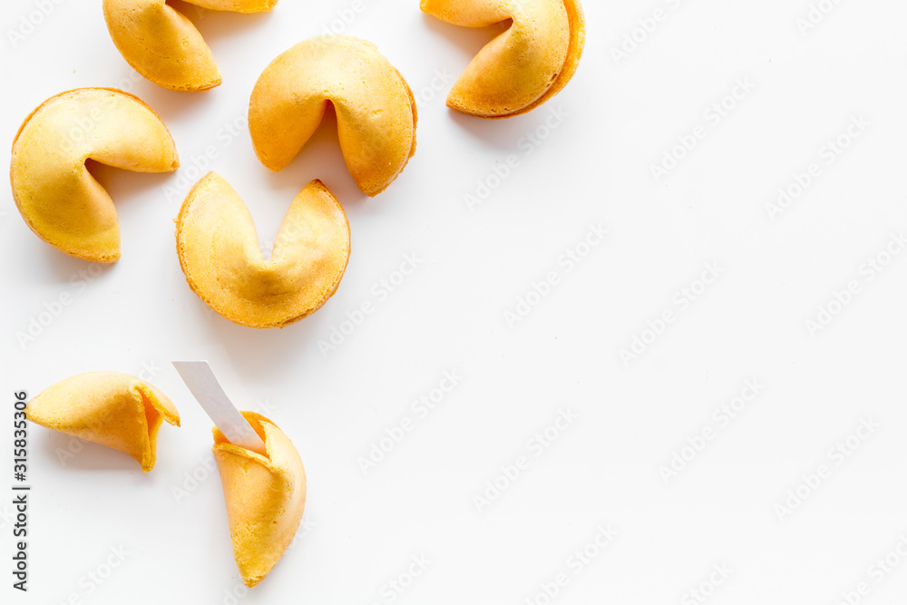 Traditional fortune cookies on white table top-down copy space