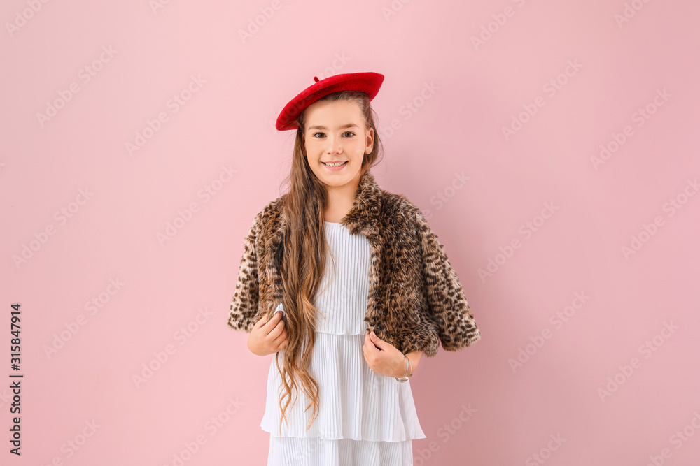 Cute fashionable girl on color background