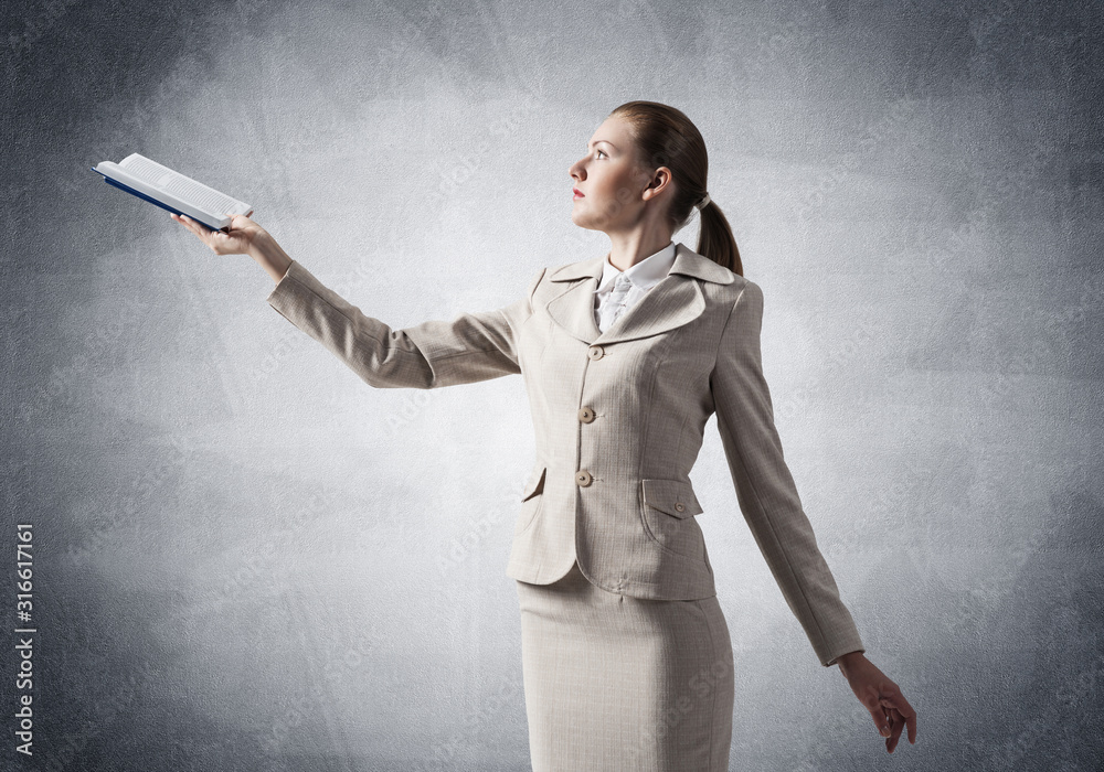 Attractive woman holding open notebook