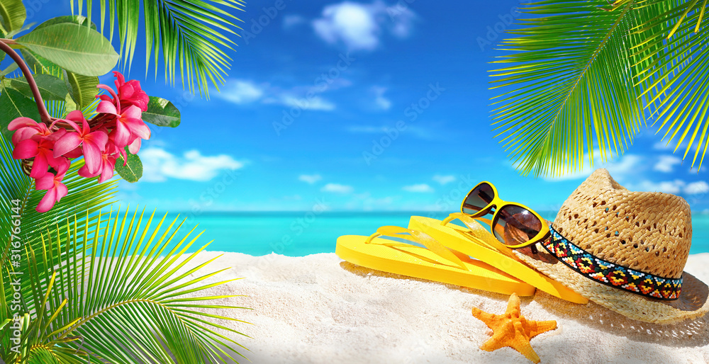 Summer background, concept beach vacation. Sunglasses, hat, flip-flops, starfish, palm leaves, frang