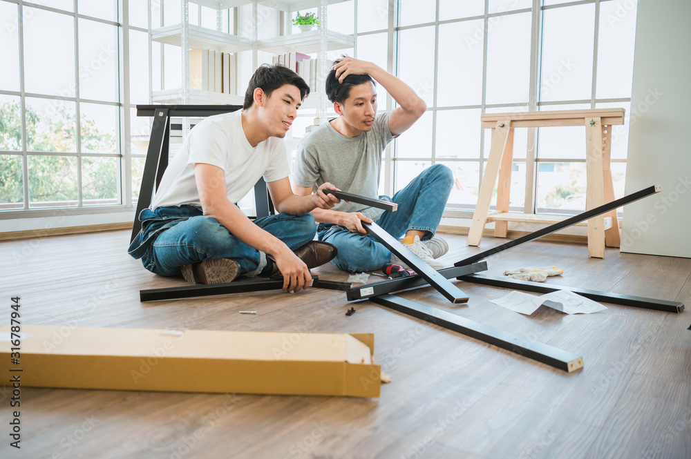 Carpenters using circular saw in workshop