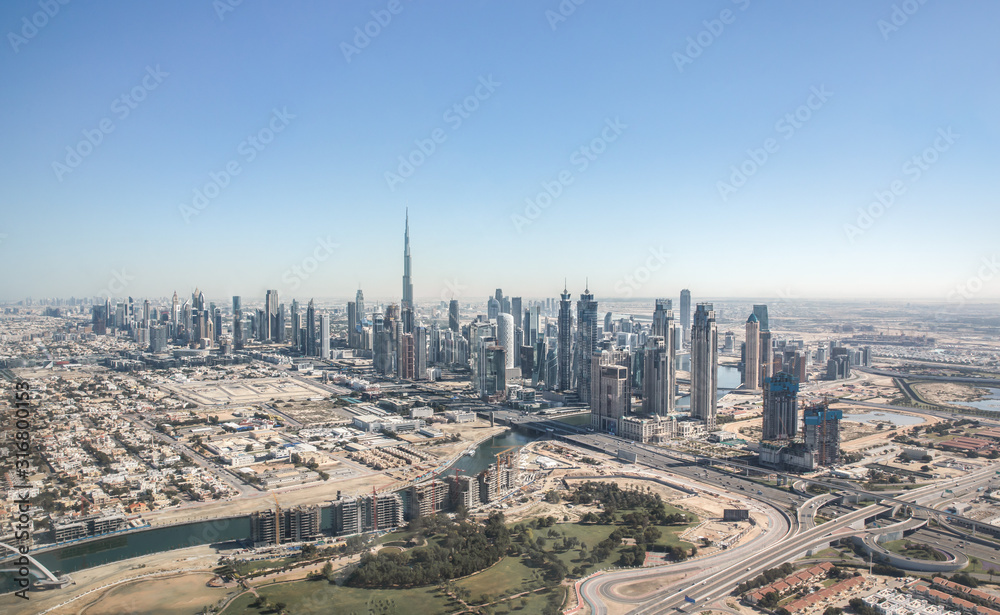 Aerial view of Dubai Downtown district as viewed from Dubai Creek and Safa park. Dubai, United Arab 