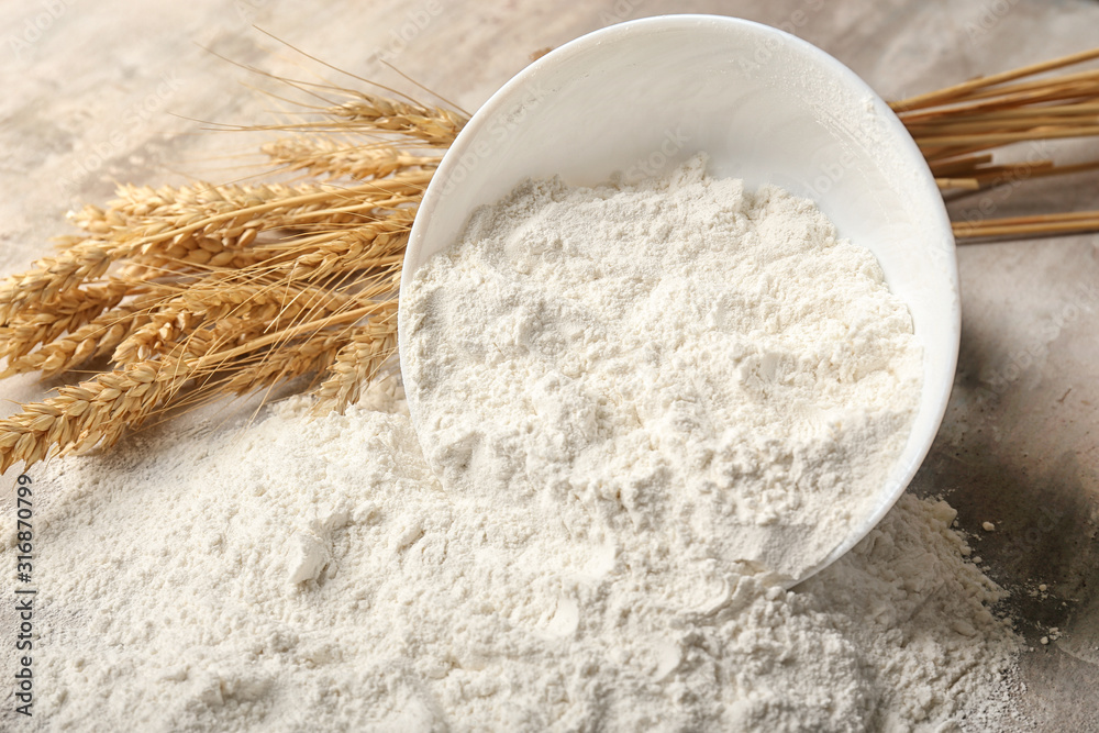 Bowl with flour on table, closeup