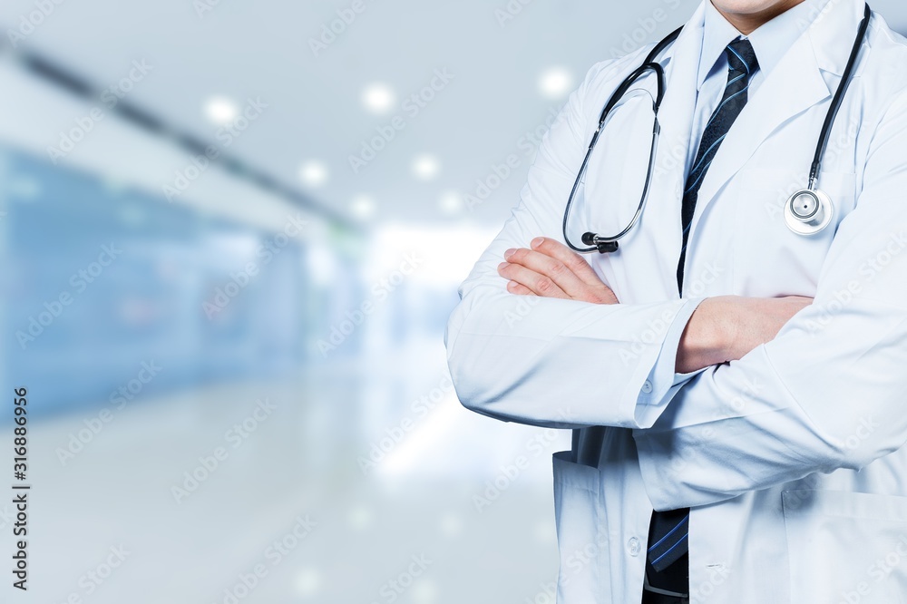 Young man doctor holding stethoscope