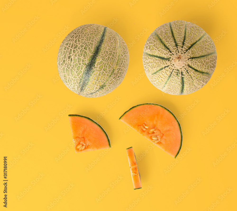 Creative layout made of melon. Flat lay. Food concept. Melon on the yellow background.