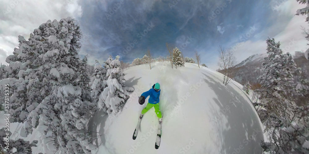 SELFIE: Man learning to ski almost crashes while riding off piste in deep powder