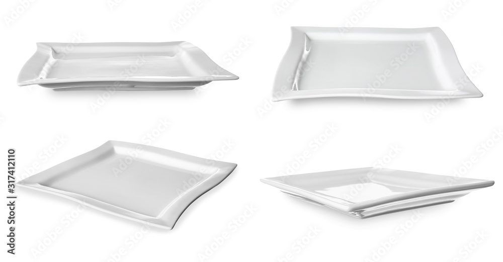 Set of empty ceramic plates on white background