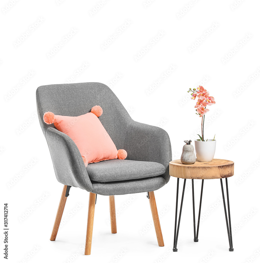 Modern armchair and table on white background