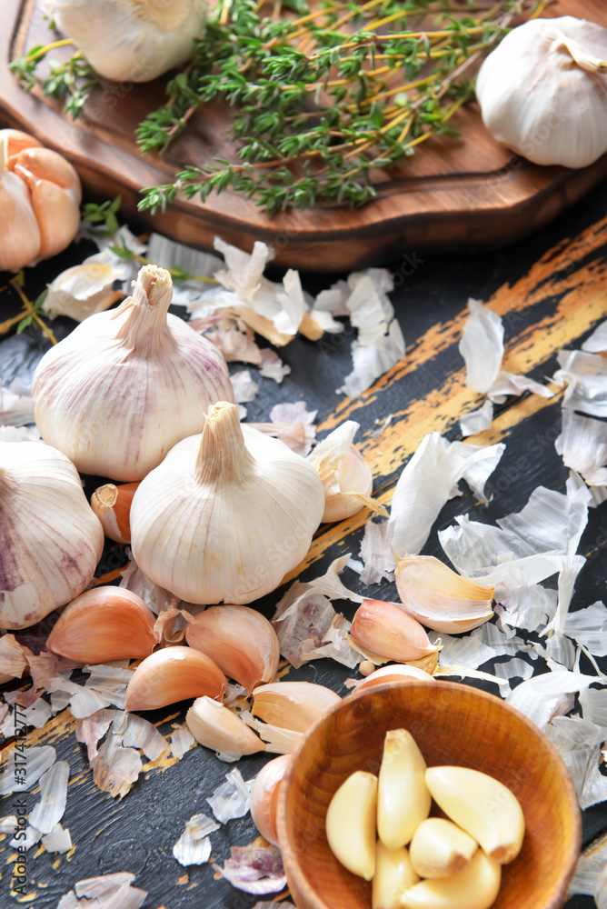 Fresh garlic on dark table