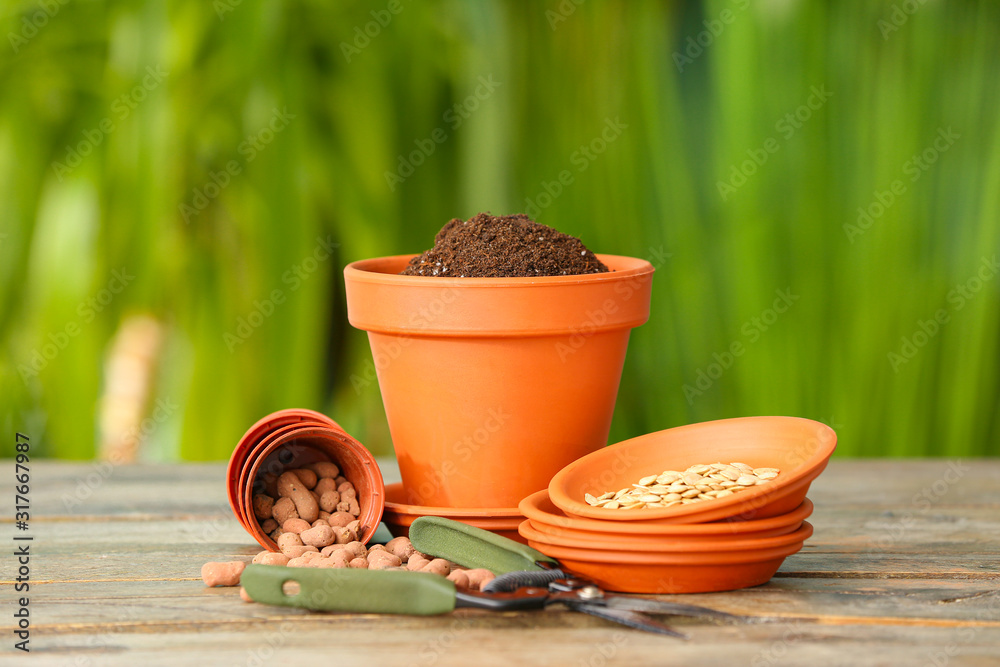 Set of gardening supplies on table outdoors