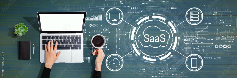 SaaS - software as a service concept with person using a laptop computer