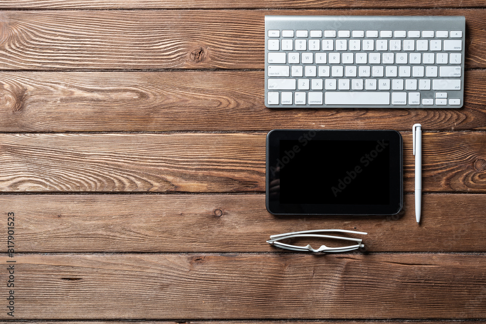 Top view of office workspace with gadgets